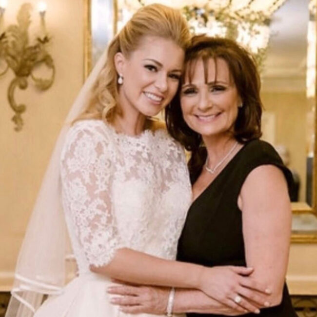 Bride and mother embracing