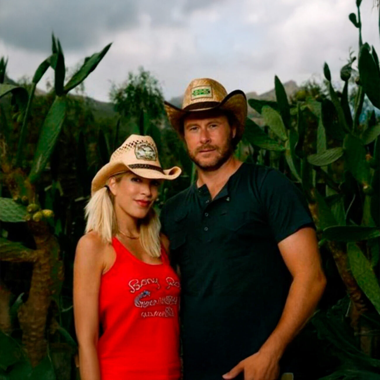 Husband and wife in the wood stock | Tori Spelling